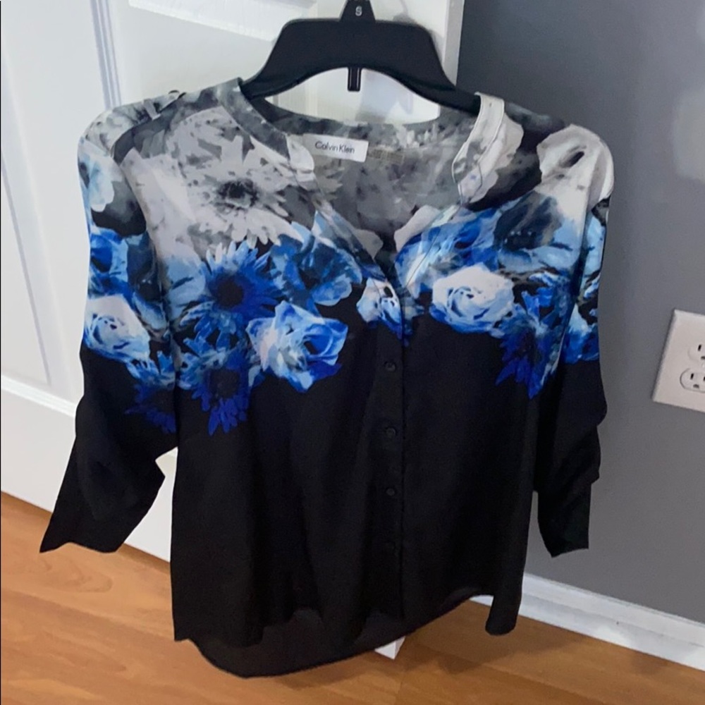 Woman’s button down floral dress shirt